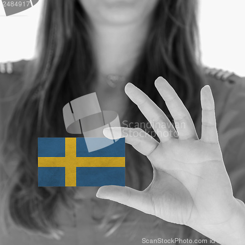 Image of Woman showing a business card