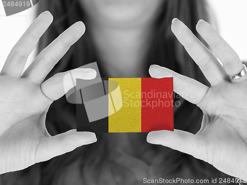 Image of Woman showing a business card