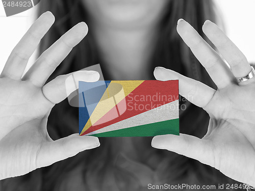 Image of Woman showing a business card