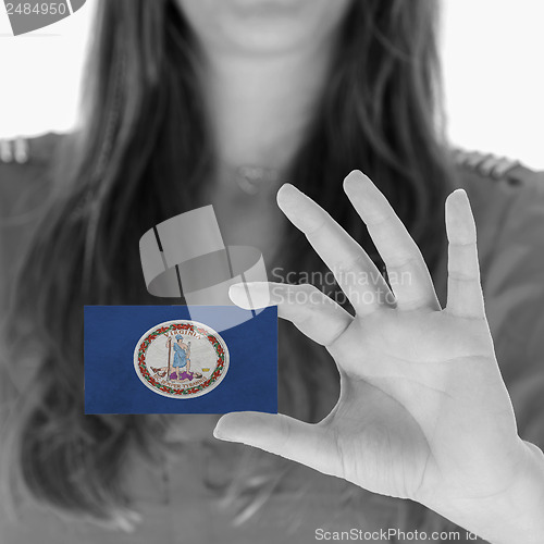 Image of Woman showing a business card