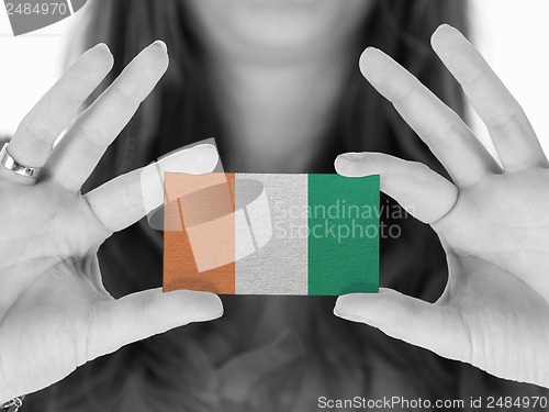 Image of Woman in showing a business card
