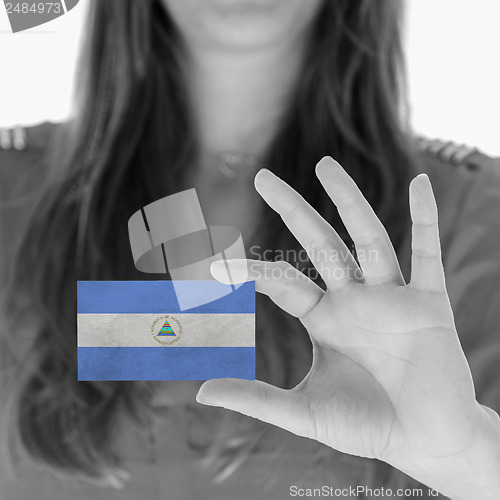 Image of Woman showing a business card