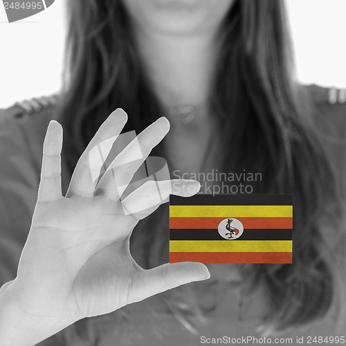 Image of Woman showing a business card
