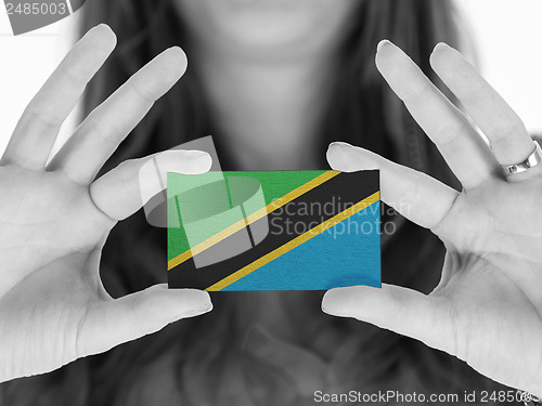 Image of Woman showing a business card