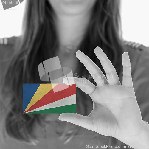 Image of Woman showing a business card