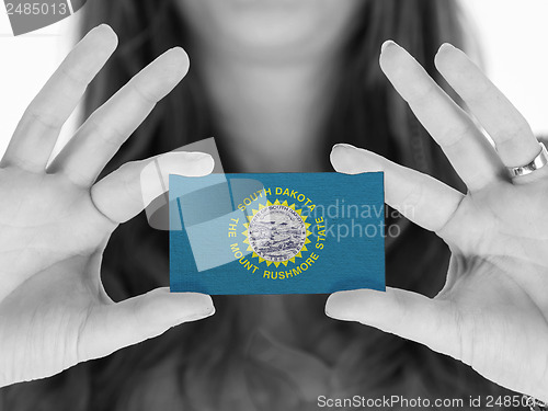 Image of Woman showing a business card