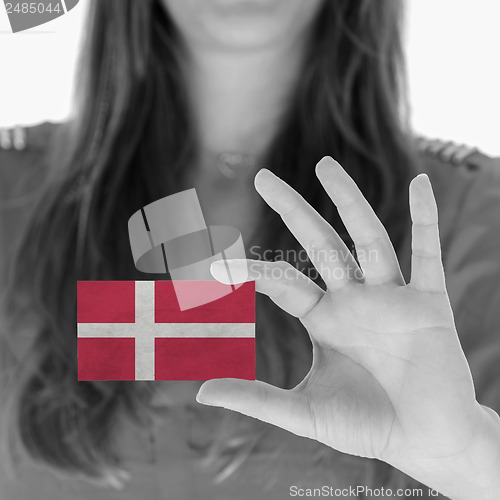 Image of Woman showing a business card