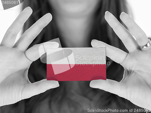 Image of Woman showing a business card