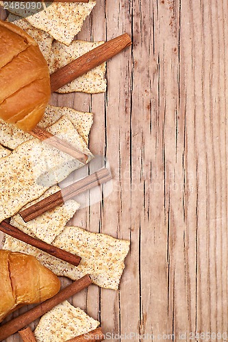 Image of crackers, cinnamon sticks and fresh croissants