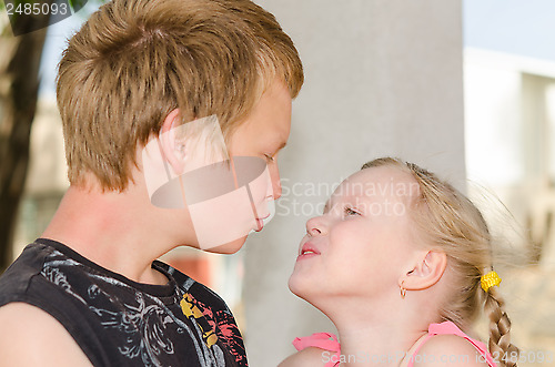 Image of First love: two kissing kids