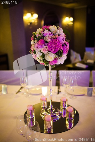 Image of Celebratory tables decorated with flowers