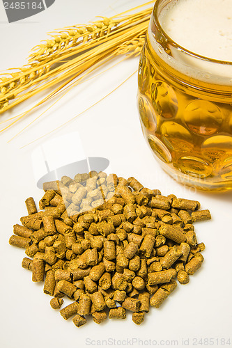 Image of Hops pellets with beer glass