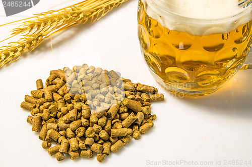 Image of Hops pellets with beer glass