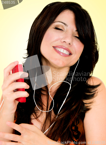 Image of Brunette with electronic mp3 player