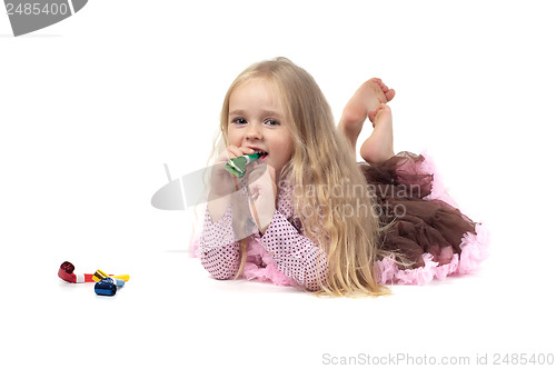 Image of Little girl in studio lying
