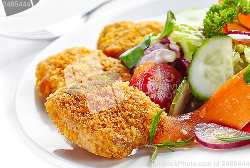 Image of chicken nuggets and vegetable salad