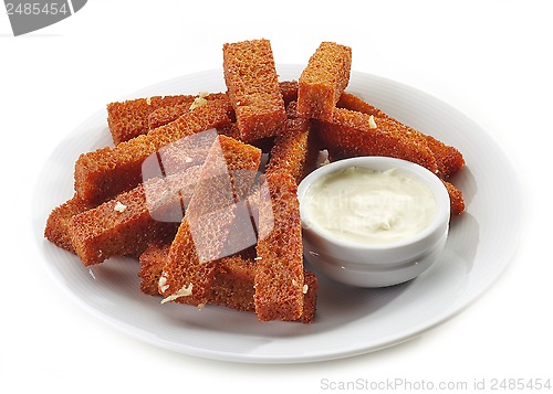 Image of fried bread sticks with garlic and sauce