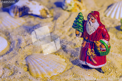 Image of Santa Claus on a beach