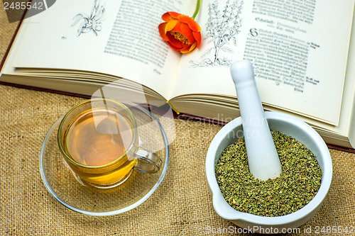 Image of Rockrose tea with medieval textbook