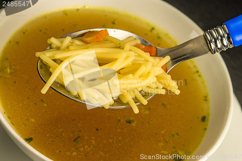 Image of beef broth with noodles