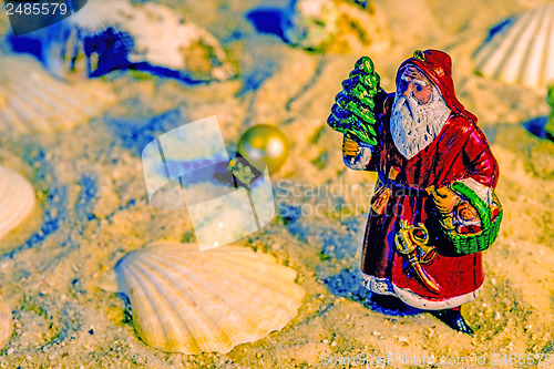 Image of Santa Claus on a beach