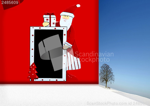 Image of Santa Claus with blackboard and winter landscape