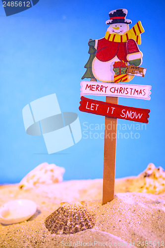 Image of Santa Claus on a beach