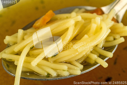 Image of beef broth with noodles