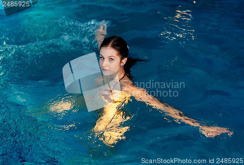 Image of Attractive girl in swimming pool
