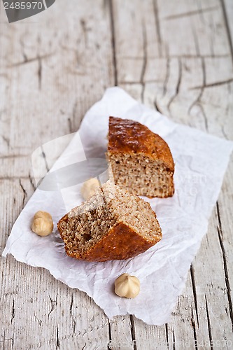 Image of two slices of fresh bun and hazelnuts