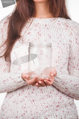 Image of Portrait of a young girl with empty jar