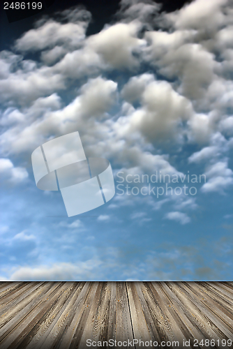 Image of old wood floor and cloudy sky