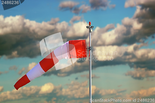 Image of windsock over stormy sky