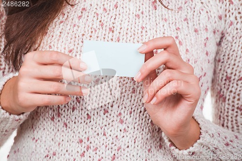 Image of hands with business card