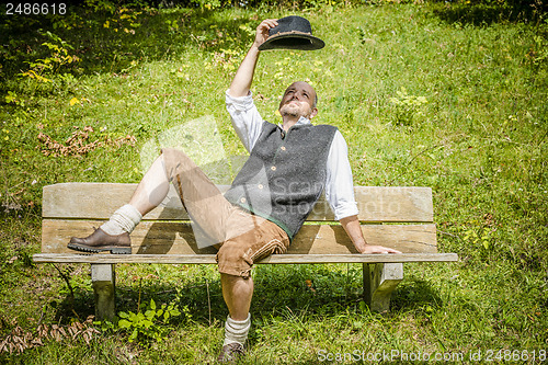 Image of Bavarian man on bench