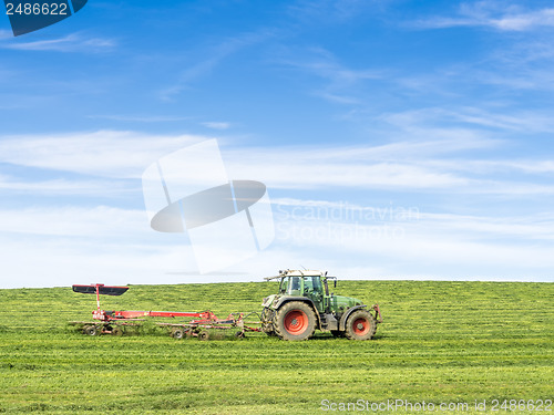 Image of Tractor on green meadow