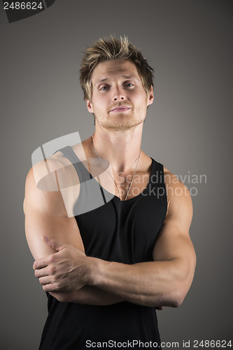 Image of Blond handsome man in black shirt