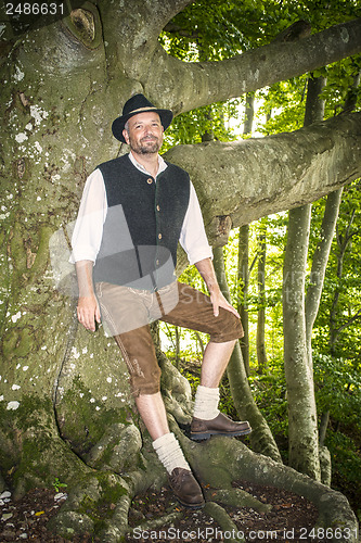 Image of Man with traditional costume in forest