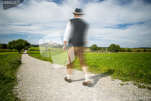 Image of Traditional Bavarian man is running