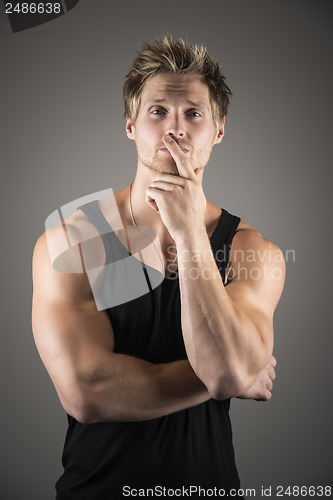 Image of Blond handsome man in black shirt