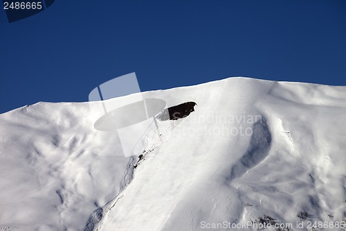 Image of Trace of avalanche on off-piste slope in sunny day