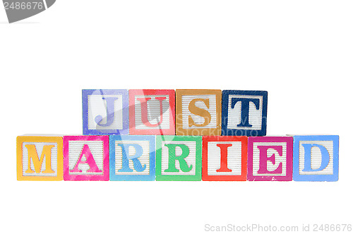 Image of Letter blocks spelling just married isolated on a white backgrou