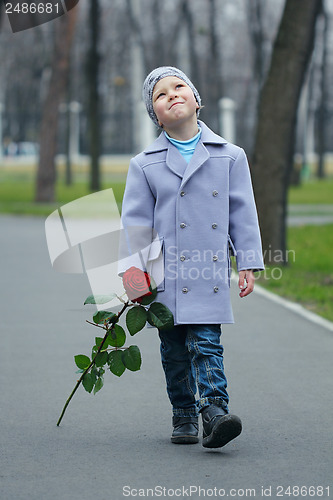 Image of Little boy walking the park