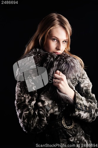 Image of Attractive woman in fur coat