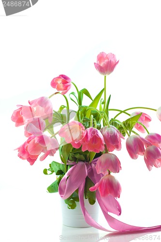Image of Beautiful pink tulips in white pot