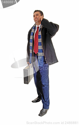 Image of Businessman on cell phone.