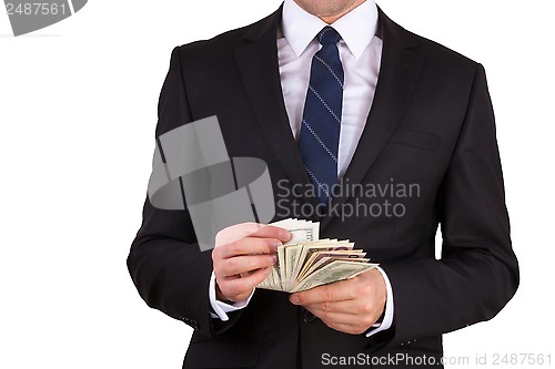 Image of Businessman is counting money
