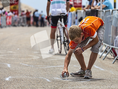 Image of Boy Paiting the Road