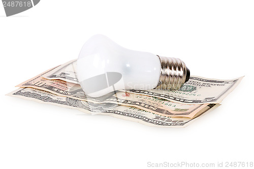 Image of bulb on dollars