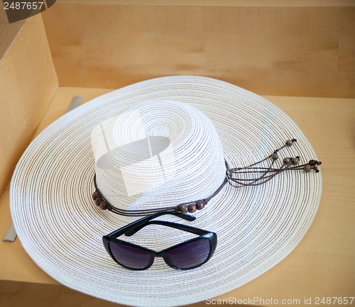 Image of Large beach hat and glasses from the sun